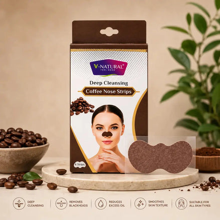 V-Natural Deep Cleansing Coffee Nose Strips packaging box shown on a beige studio background with coffee beans, a bowl, and a plant. The box is brown and white with a photo of a woman wearing a brown nose strip, and a loose brown nose strip is displayed in front.