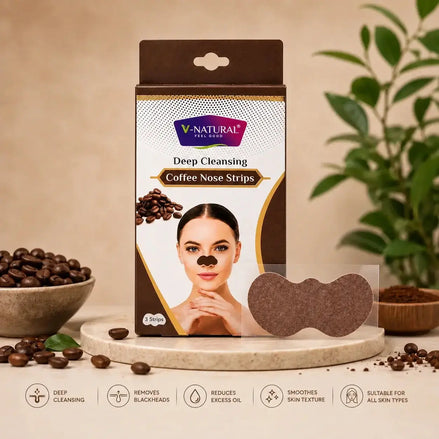 V-Natural Deep Cleansing Coffee Nose Strips in retail packaging, shown with two brown nose strips and coffee beans on a beige surface with a plant in the background.