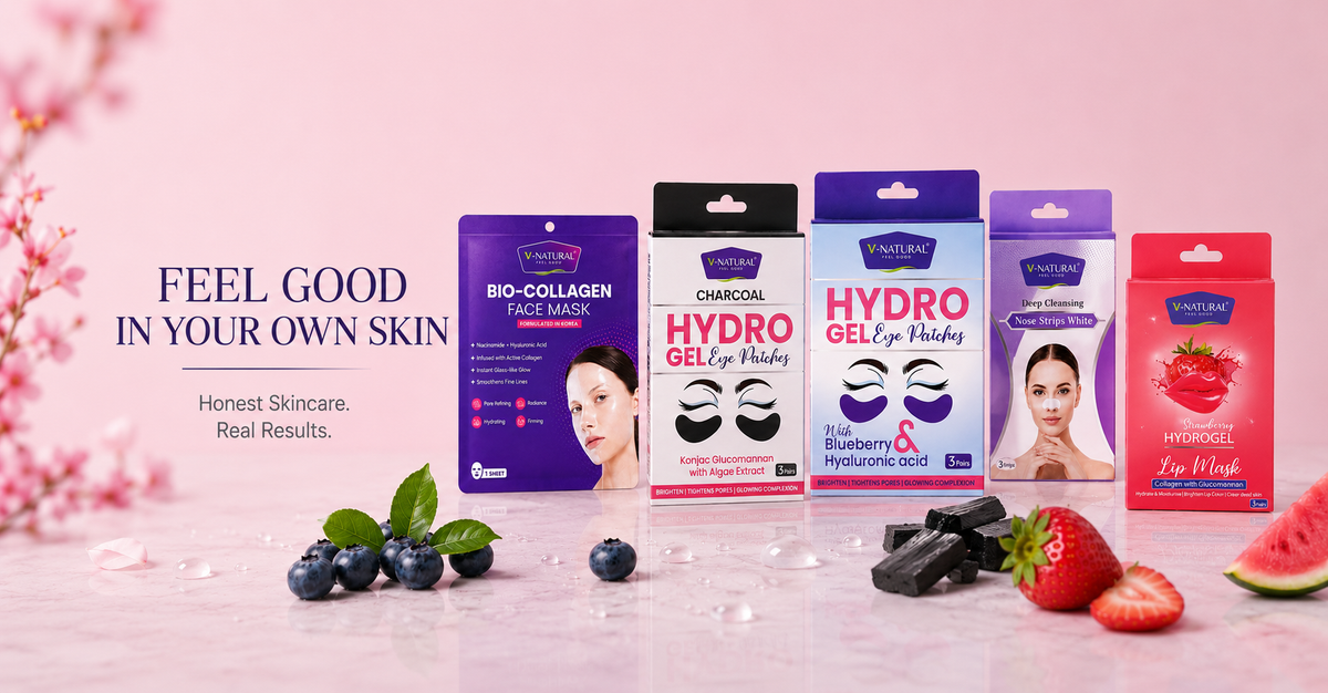 Five Vailu skincare face mask pouches lined up on a pink marble surface with decorative fruit and flowers. The packages include Bio-Collagen Face Mask, Charcoal Hydro Gel Eye Mask, Blueberry Hydro Gel Eye Mask, and Watermelon Hydro Gel Eye Mask.