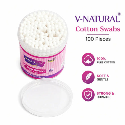 V-Natural cotton swabs in a clear plastic jar with a pink label, shown next to its lid on a white background with product feature icons.