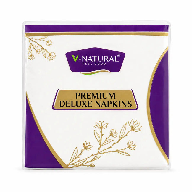 V-Natural Premium Deluxe Napkins in a white and purple pack with gold foil accents and botanical illustrations.