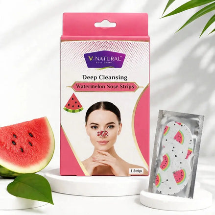V-Natural Deep Cleansing Watermelon Nose Strips packaging box displayed on a white pedestal, alongside a single watermelon-patterned nose strip in a silver pouch, with watermelon slices and green leaves as props.